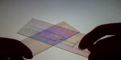 Pressure effects on light polarization through plastic