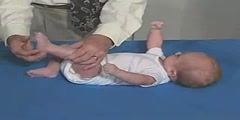 What does the grasping reflex look like from an infant?